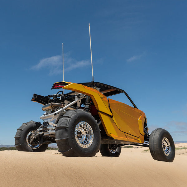 Tensor SS Sand Series paddle tire for UTVs with Velocity Grid design, 33 and 35 inch sizes, for ultimate sand traction and control.