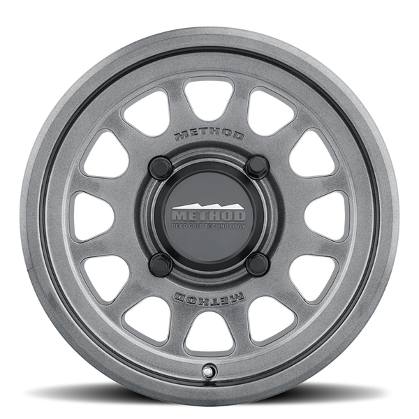 Method 414 Gloss Graphite Bead Grip® UTV Wheel with 12-window design, bead hump, and 1600 lb load rating for dunes and rugged terrain.