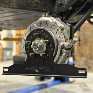 High Lifter UTV alignment plate in place on the hub, showing how the tool measures from the mounting face rather than the tire