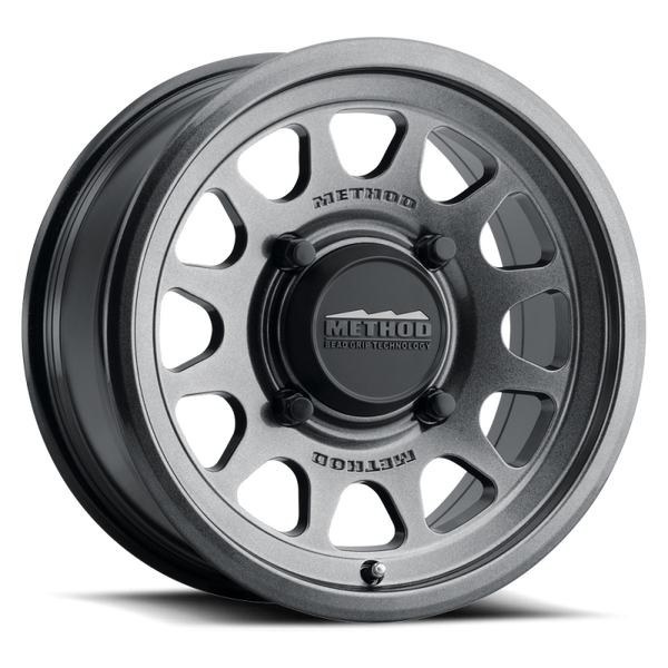 Method 414 Gloss Graphite Bead Grip® UTV Wheel with 12-window design, bead hump, and 1600 lb load rating for dunes and rugged terrain.
