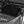Tinted polycarbonate rear window for Polaris RZR 170 with quick strap mounting and harness access panels