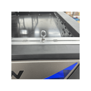 Polaris Xpedition bed rail tie-down hook by AJK Offroad shown attached to the truck bed for securing cargo.