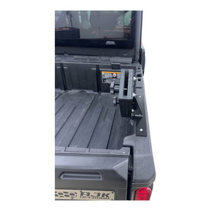 HDPE chainsaw holder detail on Can-Am Defender bed rail mount by AJK Offroad