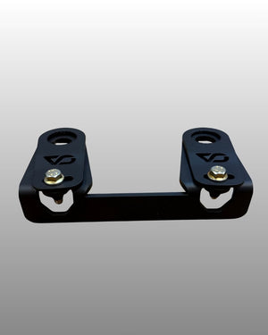 Alternate angle of the CA Tech USA Maverick R control arm bolt retainer installed