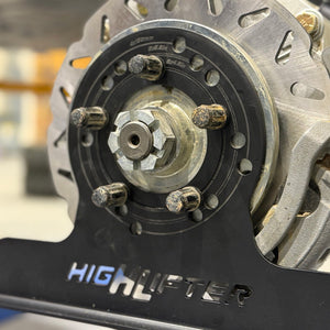 High Lifter alignment plate fitted to a side-by-side hub during a garage camber and toe check