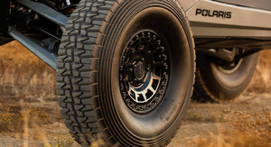 Method 415 Double Black UTV Beadlock Wheel with matte black face, gloss beadlock ring, 1600 lb rating, and aggressive multi-spoke design.