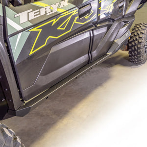 Steel rock sliders for Kawasaki TERYX KRX/4 1000 by DRT Motorsports with black powder-coat and anodized aluminum contrast panels