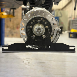 High Lifter alignment plate installed on a UTV hub, viewed from the side with the brake rotor visible behind
