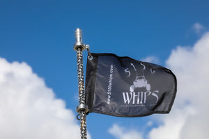 5150 187 Platinum whip (whip only), Platinum whip and black flag against sky