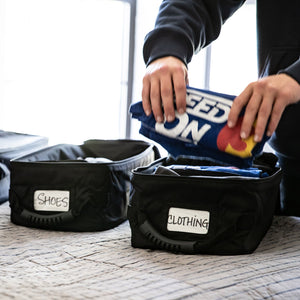 Rugged Radios adventure van cabinet bags loaded with handheld radios, tools and gear inside a van cabinet