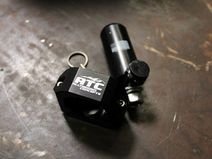 5150 billet whip mount, billet whip mount with ATC logo on a workbench