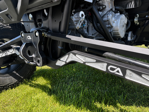 Arched CA Tech USA RZR XP S radius rod showing the high clearance profile and FK heim joints