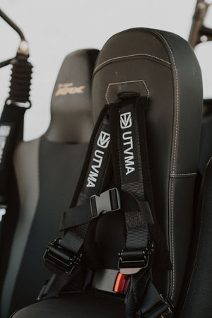 Kawasaki KRX 1000 front bump seat for kids by UTV Mountain Accessories, installed on the vehicle, showing the seat design and safety features.