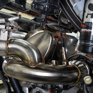Close-up of the RPM chambered muffler tip on a CFMoto Z10