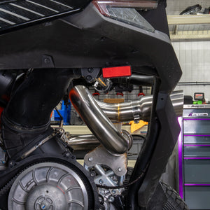 Installed RPM Z10 race pipe outlet at the rear of the machine