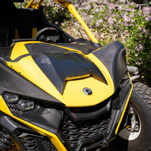 Close-up of 2x2 twill carbon fiber weave and gloss clear coat on Maverick R hood