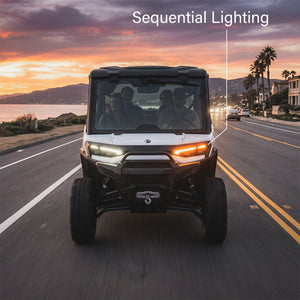 Sequential amber LED fang turn signals on a Can-Am Defender HD11, lifestyle front view
