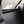 Dark tinted polycarbonate rear window for RZR XP 1000 and Turbo models with quick strap install and removable harness access panels