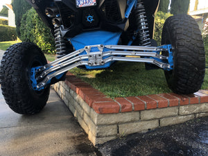 LM UTV high clearance radius rods fitted to a Can-Am Maverick X3, rear three-quarter view