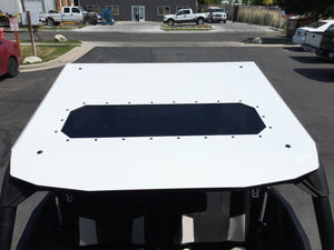 Low-profile Moto Armor Fast Back Aluminum Roof with sunroof and rear spoiler for Polaris RZR XP 1000, Turbo, and 900 UTVs.