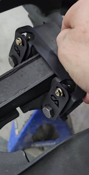 CA Tech USA lower control arm bolt retainer kit installed on a Can-Am Maverick R frame