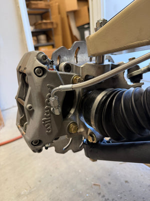 Madigan Motorsports Defender Big Brake Kit on a Can-Am Defender — mounting hardware