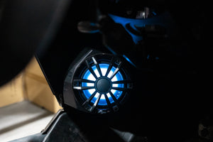 UTV Stereo speaker with LED backlighting installed in a Can-Am X3