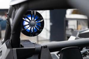UTV Stereo speaker with LED lighting mounted on a Can-Am X3 roll cage