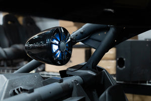 Tower speaker with LED lighting on a roll cage, shown for reference and not included