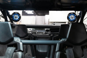 UTV Stereo speakers with LED lighting on a Can-Am X3 roll cage