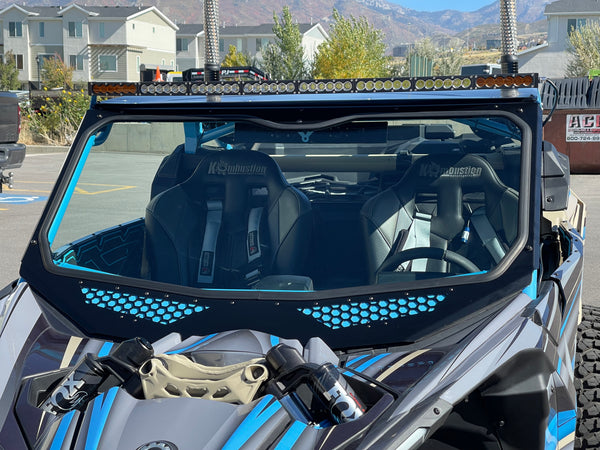 Moto Armor full glass windshield for Can-Am Maverick X3 with Voodoo Riders cage, featuring vents, DOT glass, and billet mounts.