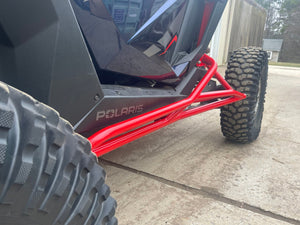 L&W Fab Polaris RZR Pro R 2-seat rock sliders and tree kickers installed on side of off-road UTV for protection and style