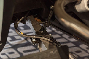 Bolt-on Smart Shock brackets for CAN-AM X3 HCR control arms, made from HCR steel with black powder coat and fast, drill-free install