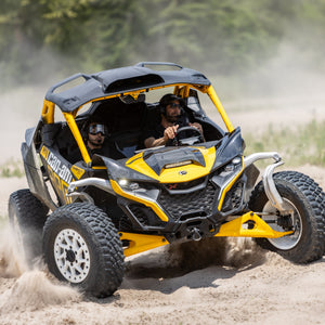 Can-Am Maverick R with RPM carbon fiber hood installed during off-road driving