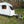 Trailer-Tug Monster-Tug towing device with rugged design, shown attached to a camper on a mountain trail.