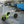Trailer-Tug Monster-Tug towing flatbed truck carrying gravel on a four-square trailer.
