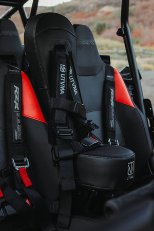 UTV Mountain Accessories RZR 1000 2-Seat Front Bump Seat for 2024-2025 off-road vehicle, showing durable seat with harness attachment points.