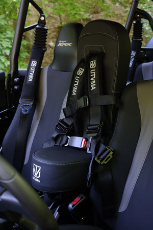 Kawasaki KRX 1000 front bump seat for kids, UTV Mountain Accessories, visible in black with padded design for safety.