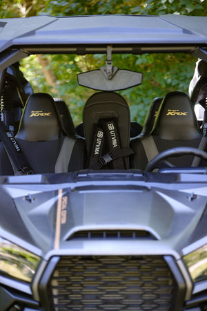 Kawasaki KRX 1000 front bump seat for kids by UTV Mountain Accessories, shown installed on off-road vehicle in rugged outdoor setting.