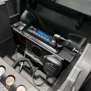 Rugged Radios mobile radio kit installed in a RAM TRX center console with the radio and hand mic in place