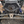 Trinity Racing RZR Pro R 4 slip-on exhaust angled view showing center-exit outlet