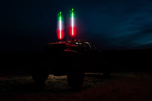 5150 Hyper Color Platinum whip, UTV at dusk with two whips lit red white and green