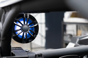 UTV Stereo Signature 6.5 inch speaker with LED lighting in a Can-Am X3 cage pod