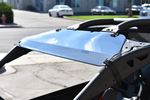 UTVZILLA tinted polycarbonate visor installed on a Can-Am X3 with factory roof and roll cage