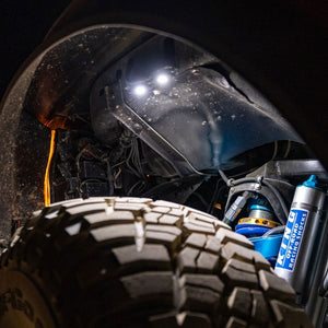 Baja Designs LED, Rock Light in white shown in a fender well - Dunes 2 Dezert SXS