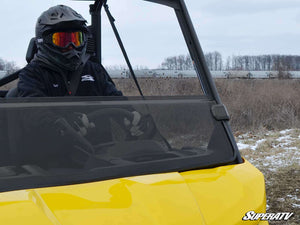 SuperATV half windshield on a Defender cage, angled view
