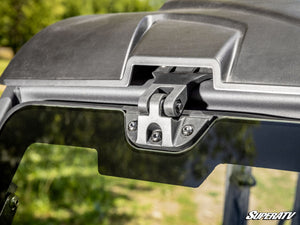 SuperATV power flip glass windshield clamp detail on a Defender