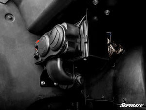Side view of the SuperATV cab heater mounted under the dash of a Can-Am Commander 1000