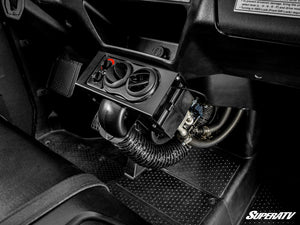 SuperATV cab heater and coolant hoses mounted between the seats of a Honda Pioneer 1000