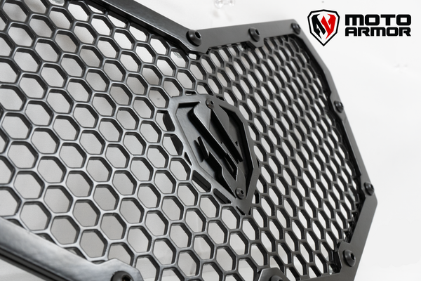 Moto Armor radiator grill set for 2017–2024 Can-Am Maverick X3 models, crafted from thick aluminum with honeycomb design for airflow and protection.